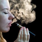 Woman inhaling